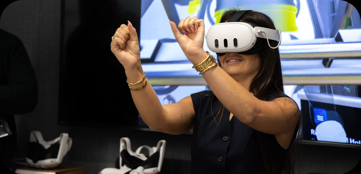 Person using a VR headset on our virtual reality platform and interacting with a virtual element