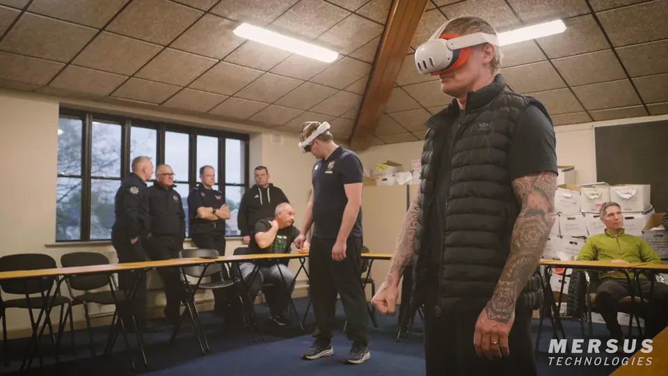 Trainees in VR headsets at Athlone Fire Station, with firefighters watching