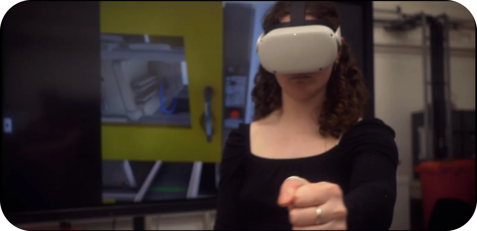 Trainee using hand tracking in VR for injection moulding training